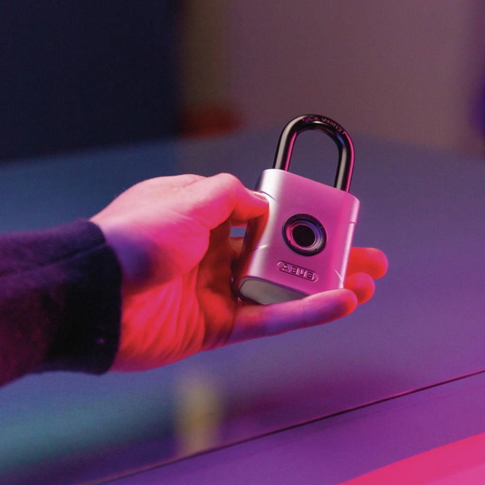 
                  
                    hand holding a Abus Touch Biometric Fingerprint Padlock
                  
                
